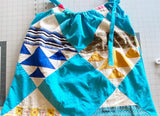 Tank top with adjustable drawstring tie upcycled from quilt