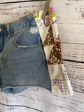 Boho cutoff denim shorts with vintage quilt patchwork