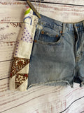 Boho cutoff denim shorts with vintage quilt patchwork
