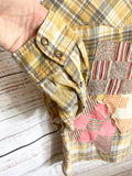 Altered gray and yellow flannel women’s vintage quilt blocks and doilies