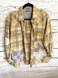 Altered gray and yellow flannel women’s vintage quilt blocks and doilies
