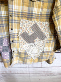 Altered gray and yellow flannel women’s vintage quilt blocks and doilies