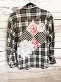 Altered black and white flannel women’s vintage quilt blocks and doilies