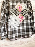Altered black and white flannel women’s vintage quilt blocks and doilies